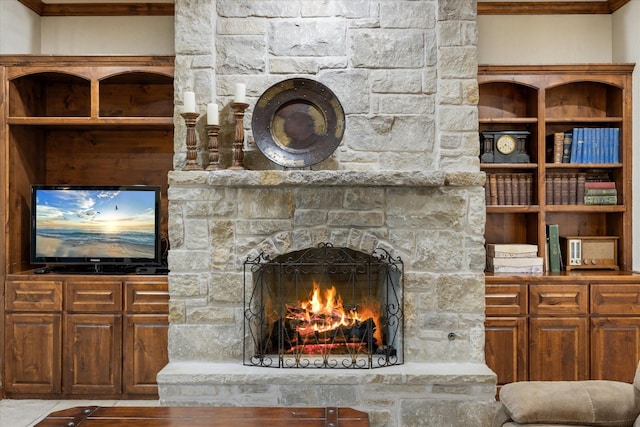 living room with a stone fireplace