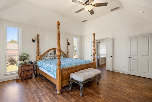 bedroom with ceiling fan, ensuite bathroom, dark hardwood / wood-style floors, and vaulted ceiling