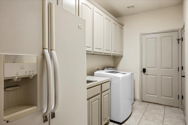 laundry area featuring cabinets