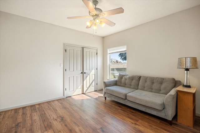 living room featuring hardwood / wood-style flooring and ceiling fan