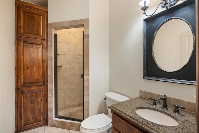 bathroom with an enclosed shower, vanity, and toilet