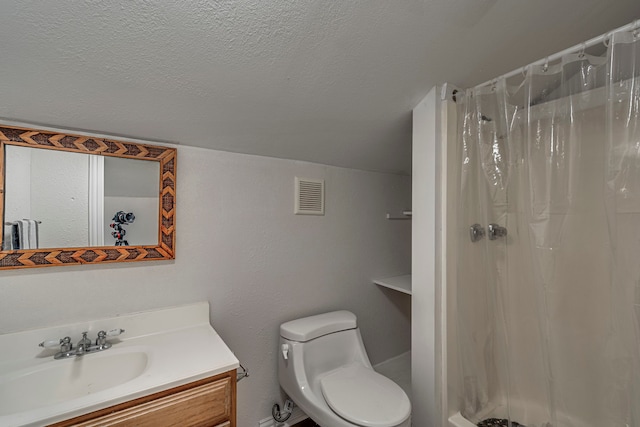 bathroom featuring vanity, curtained shower, a textured ceiling, and toilet