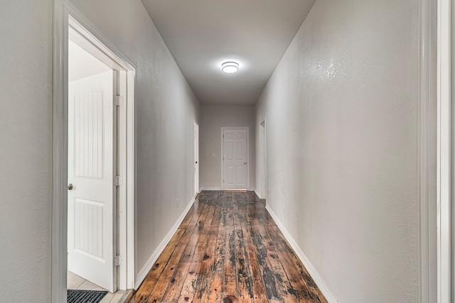 hall with dark hardwood / wood-style floors