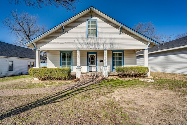 view of front of house featuring a front lawn and a porch