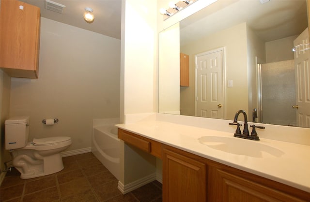 bathroom featuring toilet, tile patterned floors, vanity, and a bath