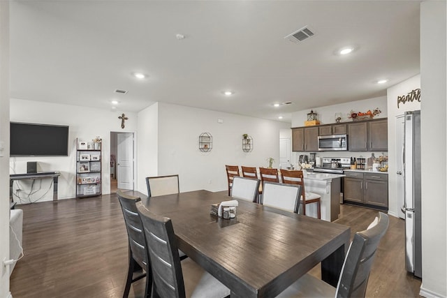 dining room featuring dark hardwood / wood-style flooring