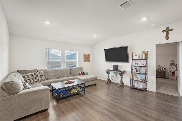 living room featuring lofted ceiling and dark hardwood / wood-style flooring