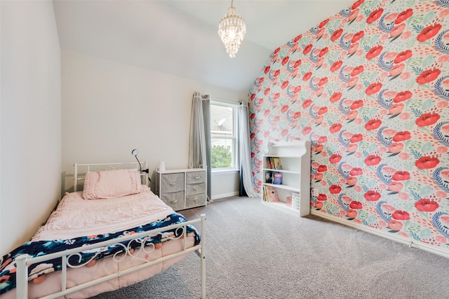 bedroom featuring lofted ceiling, carpet flooring, and a notable chandelier