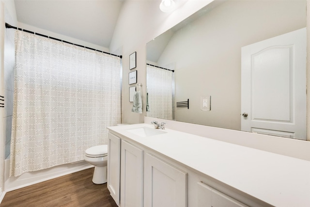 full bathroom with lofted ceiling, hardwood / wood-style flooring, vanity, toilet, and shower / bath combo with shower curtain