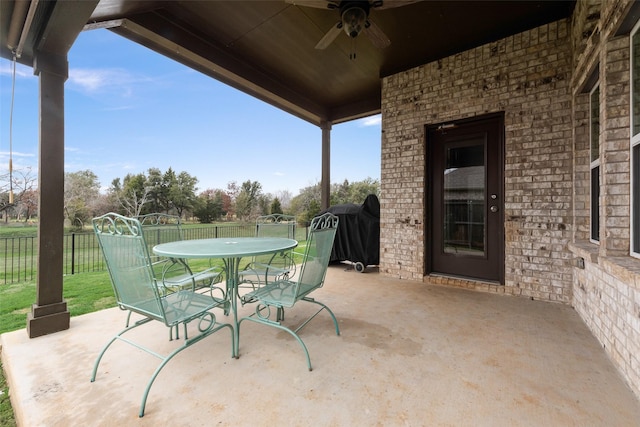 view of patio featuring ceiling fan and grilling area