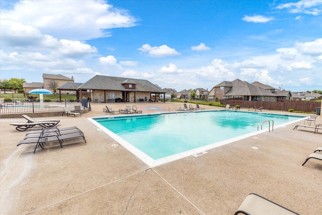 view of swimming pool with a patio area