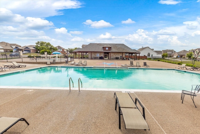 view of swimming pool featuring a patio area