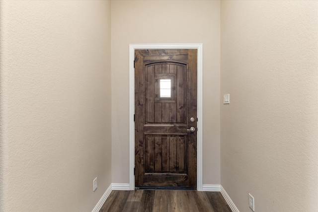 entrance foyer with dark hardwood / wood-style floors