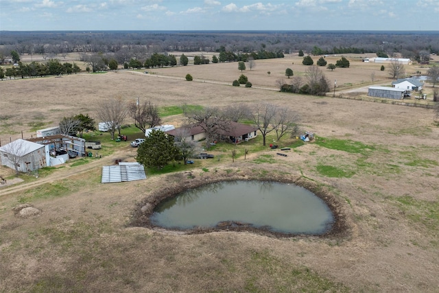 drone / aerial view featuring a water view and a rural view