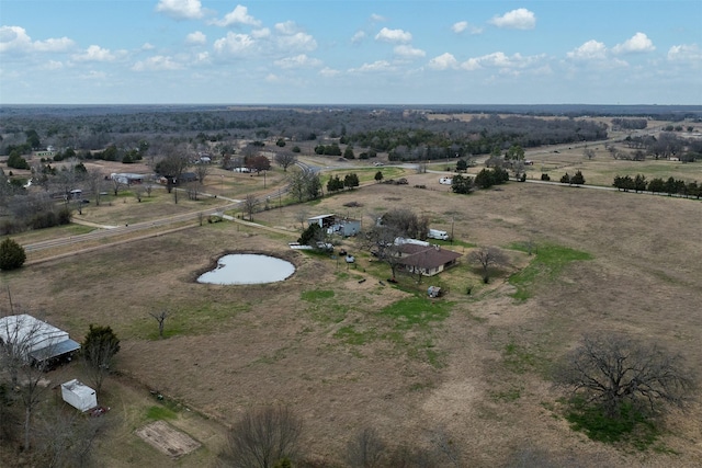 birds eye view of property with a rural view