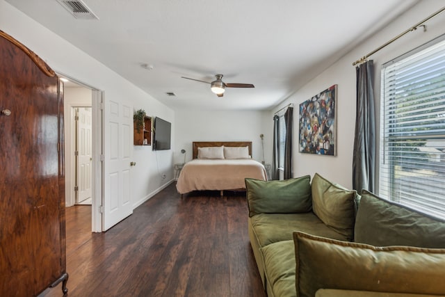 bedroom featuring dark hardwood / wood-style floors and ceiling fan