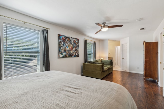 bedroom with dark wood-type flooring and ceiling fan