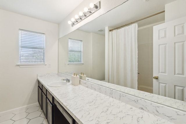 bathroom featuring vanity and tile patterned flooring