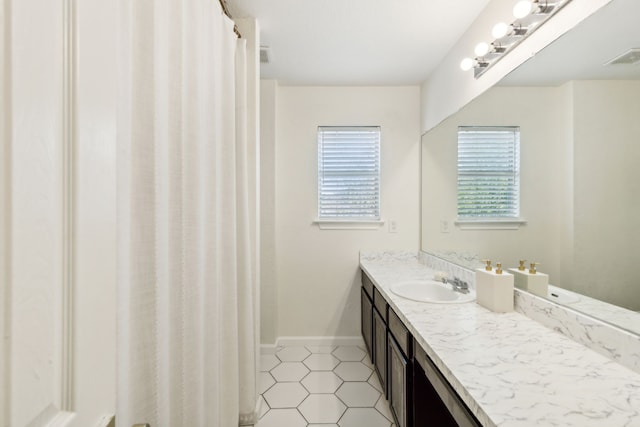 bathroom featuring tile patterned floors and vanity