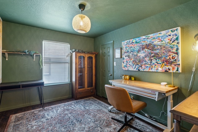 office space with wood-type flooring and a textured ceiling