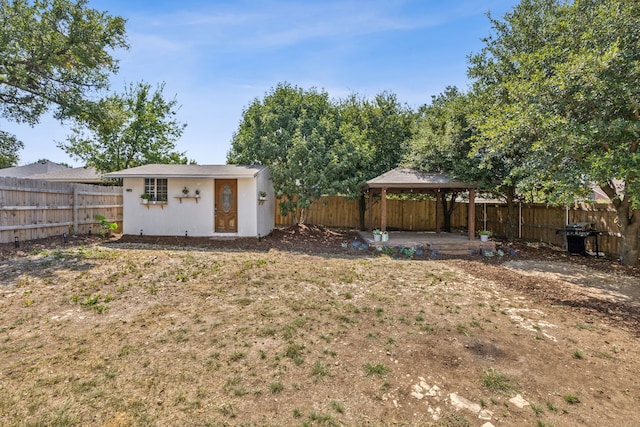 view of yard featuring a gazebo and an outdoor structure