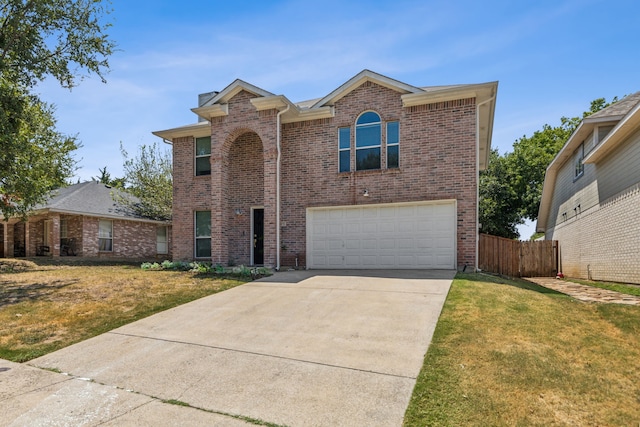 view of front property with a garage and a front lawn