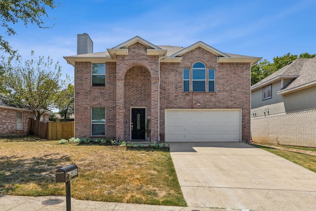 front of property featuring a garage and a front lawn