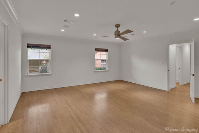 spare room with crown molding, ceiling fan, plenty of natural light, and light hardwood / wood-style floors