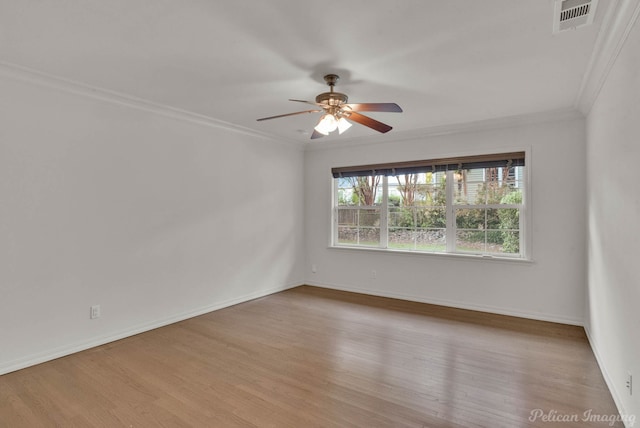 unfurnished room featuring ornamental molding, ceiling fan, and light wood-type flooring