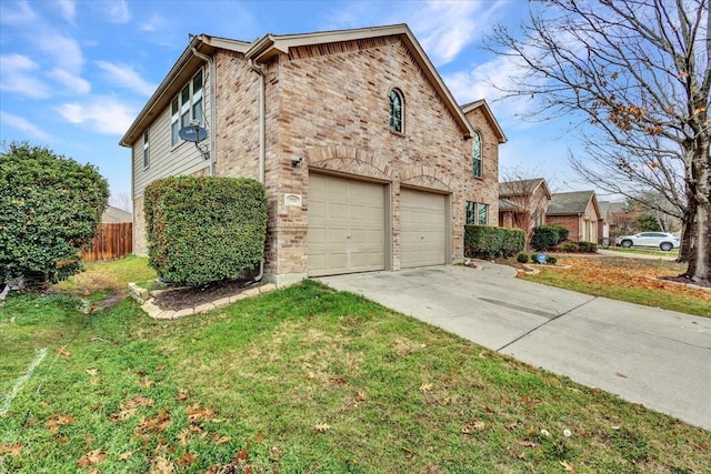 view of side of property featuring a garage and a yard