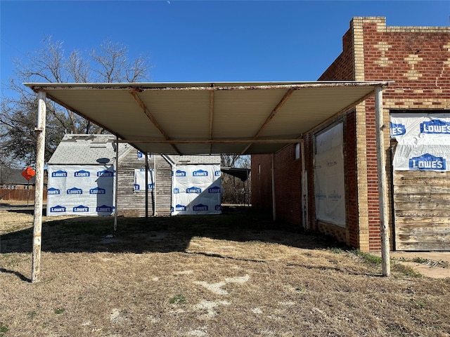 view of vehicle parking featuring a carport