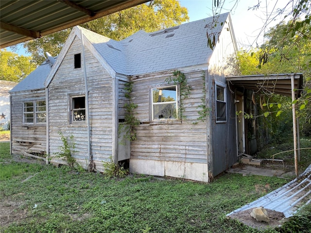 view of home's exterior featuring a lawn