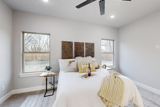 carpeted bedroom featuring ceiling fan