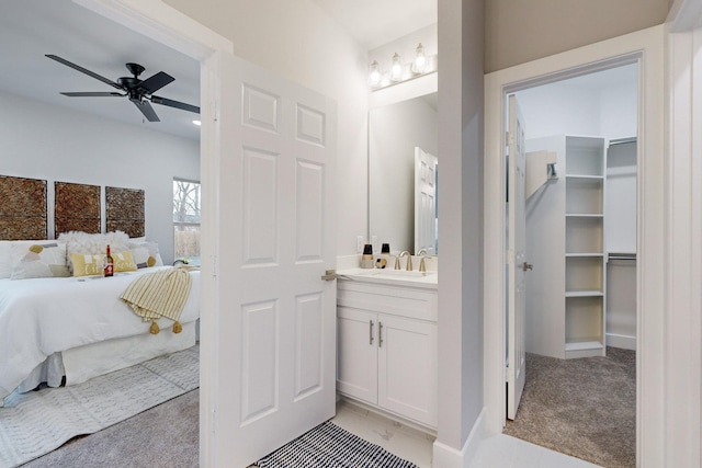 bathroom featuring vanity and ceiling fan