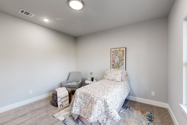 bedroom with light colored carpet