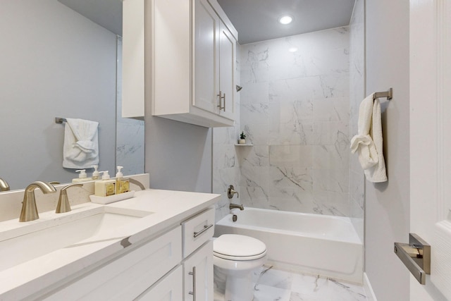 full bathroom with vanity, tiled shower / bath combo, and toilet