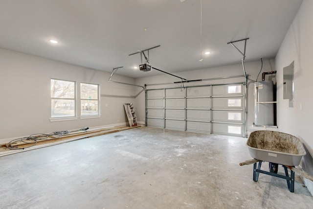 garage with a garage door opener and electric panel