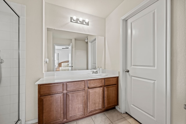 bathroom featuring walk in shower, tile patterned floors, and vanity