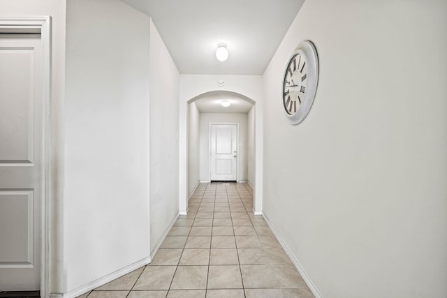 corridor featuring light tile patterned flooring