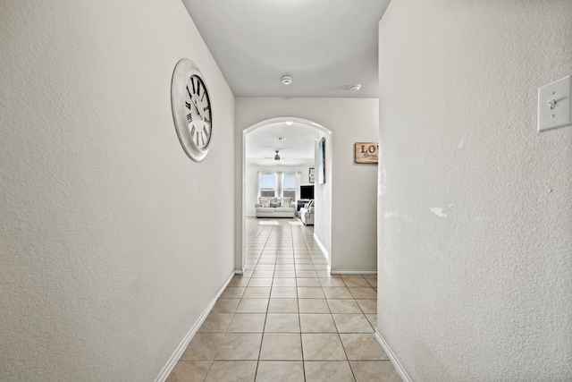 corridor featuring light tile patterned floors