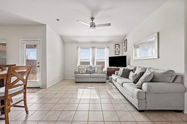 living room with ceiling fan and light tile patterned floors