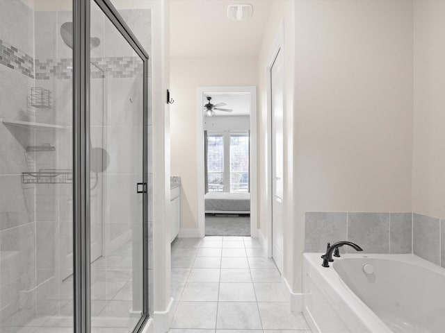 full bath featuring a shower stall, ensuite bath, a bath, baseboards, and tile patterned floors