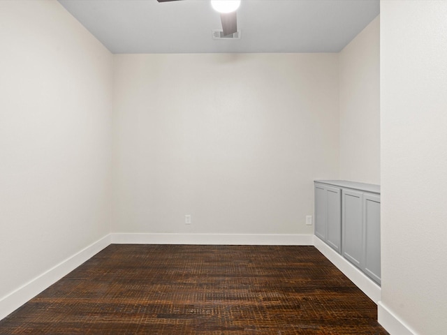 spare room with visible vents, baseboards, and a ceiling fan