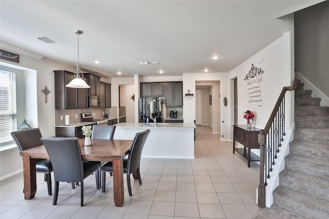 dining room with light tile patterned flooring