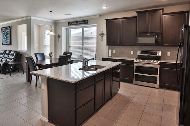 kitchen with pendant lighting, sink, light tile patterned floors, and black appliances