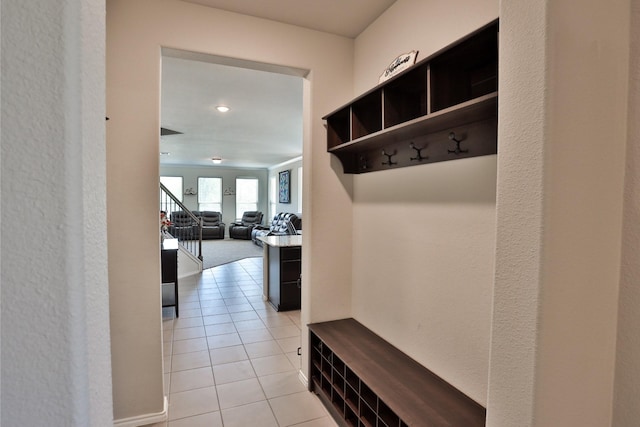 mudroom with light tile patterned flooring