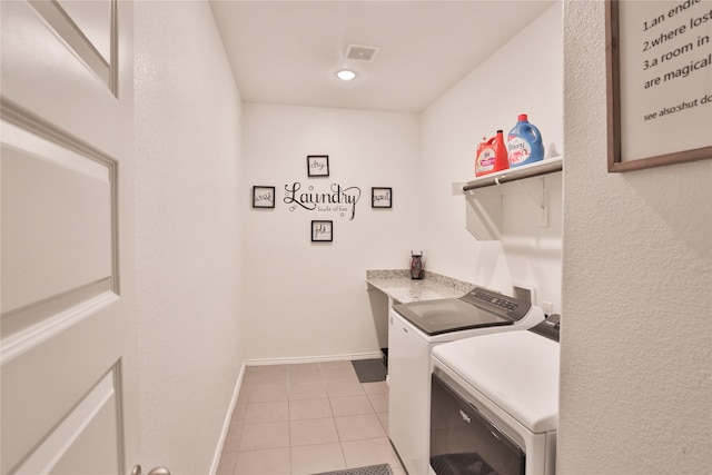 washroom featuring independent washer and dryer and light tile patterned floors