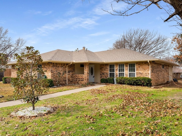 ranch-style home with a front lawn