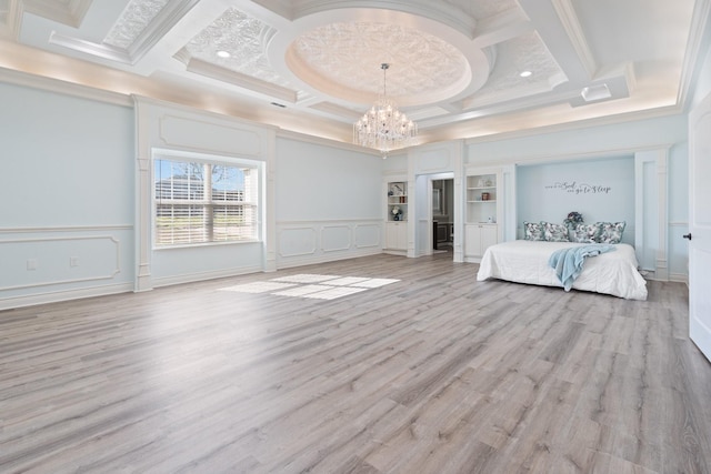 unfurnished bedroom featuring an inviting chandelier, light wood-type flooring, ornamental molding, coffered ceiling, and beam ceiling