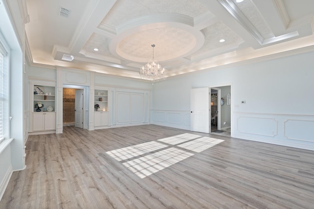 unfurnished living room with beamed ceiling, crown molding, an inviting chandelier, and light hardwood / wood-style floors